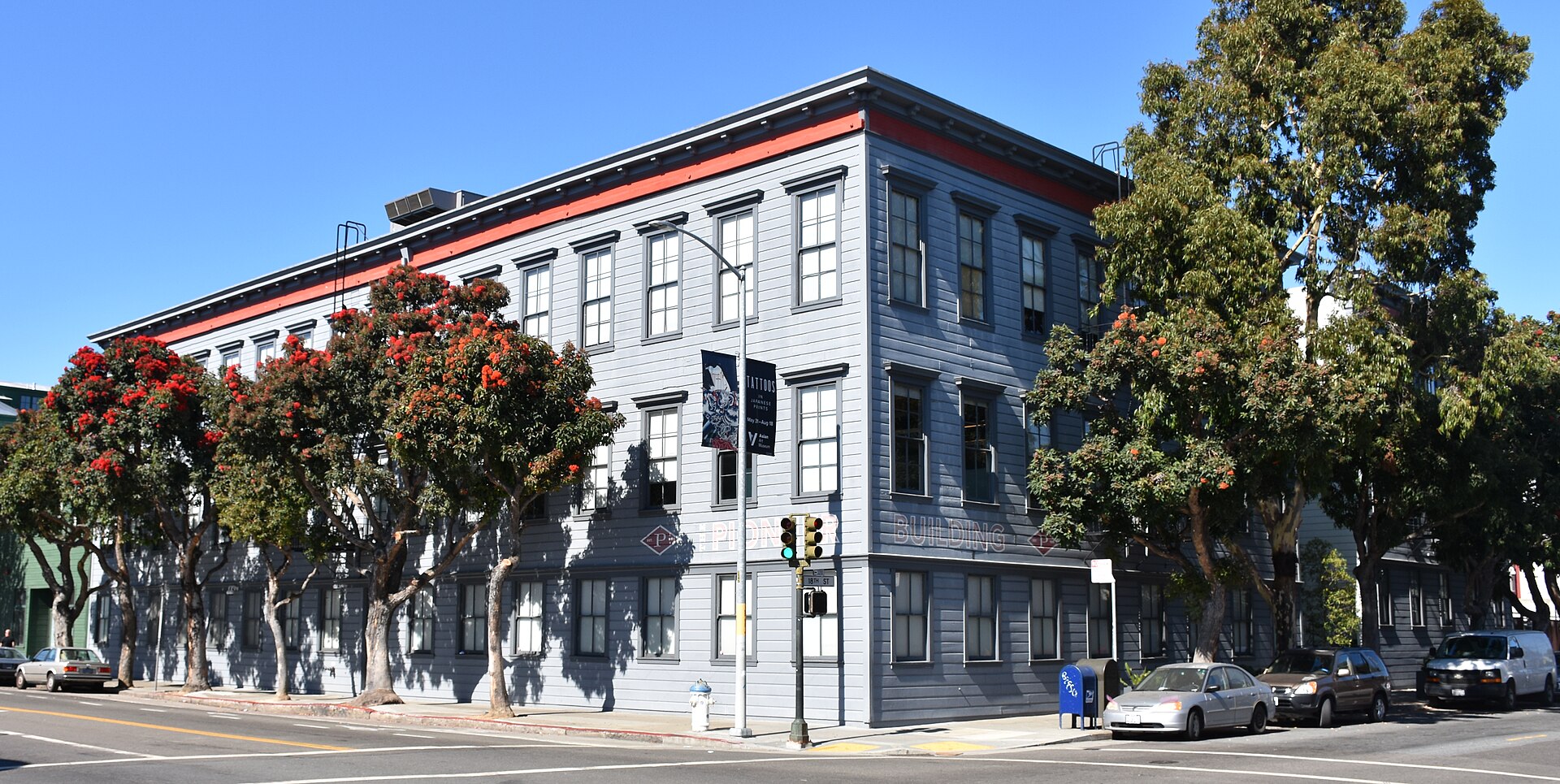The Pioneer Building, a brick industrial building in San Francisco's Mission District, photographed from the street in 2019, when it housed the offices of OpenAI and Neuralink.